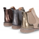 Combined leather kids ankle boots with elastic band and thick outsole.