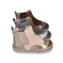 Combined leather kids ankle boots with elastic band and thick outsole.