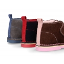 Suede leather kids Safari boots laceless and fake hair lining.