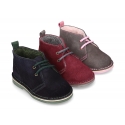 Suede leather kids safari boots with shoelaces and fake hair lining.