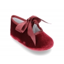 Velvet little Mary Janes for babies with ties closure.