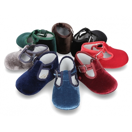 Velvet canvas T-Strap shoes for babies with hook and loop strap.