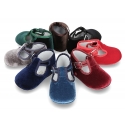 Velvet canvas T-Strap shoes for babies with hook and loop strap.